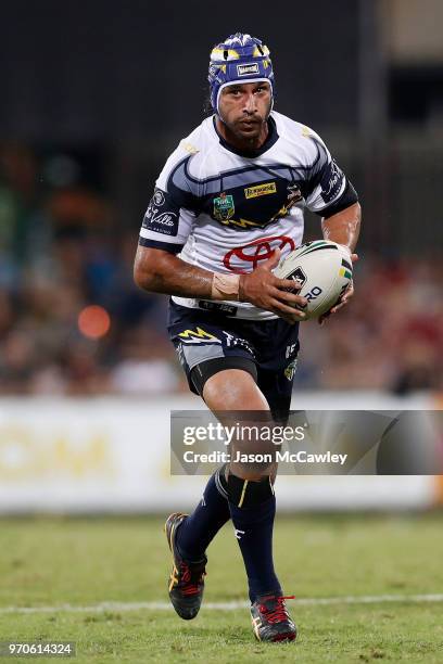 Johnathan Thurston of the Cowboys runs with the ball during the round 14 NRL match between the Parramatta Eels and the North Queensland Cowboys at...