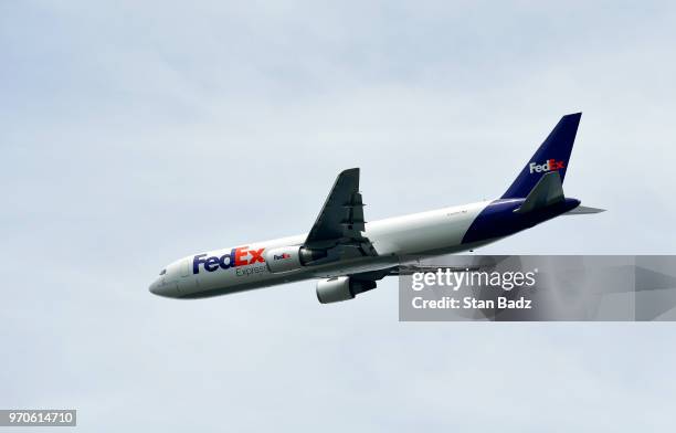 FedEx airplane flys over the golf course during the third round of the FedEx St. Jude Classic at TPC Southwind on June 9, 2018 in Memphis, Tennessee.