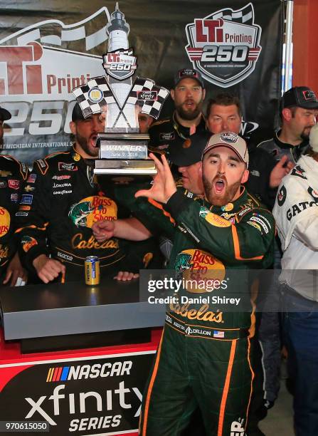 Austin Dillon, driver of the Bass Pro Shops/Cabela's Chevrolet, celebrates with the trophy after winning the NASCAR Xfinity Series LTi Printing 250...