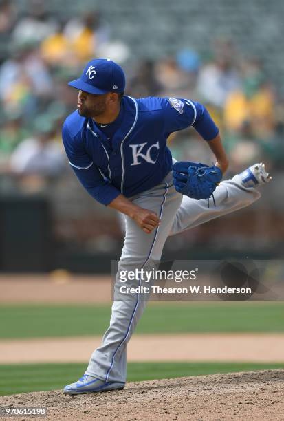 Kelvin Herrera of the Kansas City Royals pitches against the Oakland Athletics in the bottom of the ninth inning at the Oakland Alameda Coliseum on...