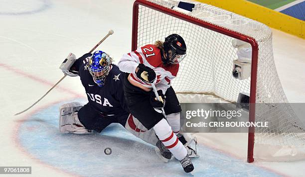 S goalkeeper Jessie Vetter tries to block the puck during the Women's Gold Medal Hockey game between USA and Canada at the Canada Hockey Place during...