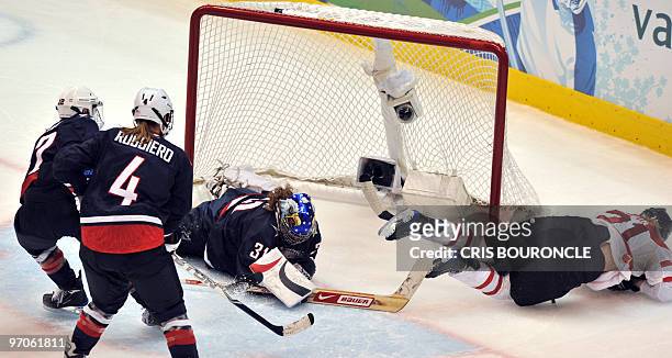 S goalkeeper Jessie Vetter tries to stop the puck during the Women's Gold Medal Hockey game between USA and Canada at the Canada Hockey Place during...