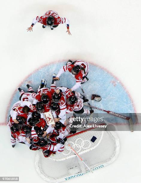 Team Canada celebrate winning the gold medal following their 2-0 victory during the ice hockey women's gold medal game between Canada and USA on day...