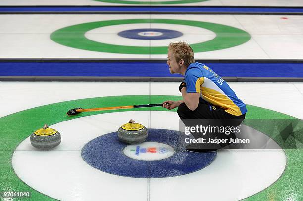 Skip Niklas Edin of Sweden follows the stone during the men's curling semifinal game between Canada and Sweden on day 14 of the Vancouver 2010 Winter...