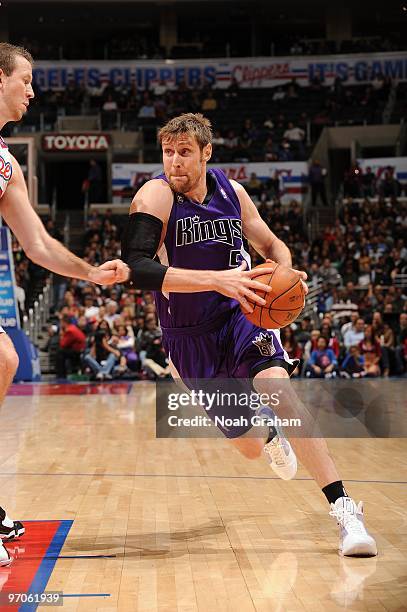 Andres Nocioni of the Sacramento Kings drives to the basket against Steve Novak of the Los Angeles Clippers during the game at Staples Center on...