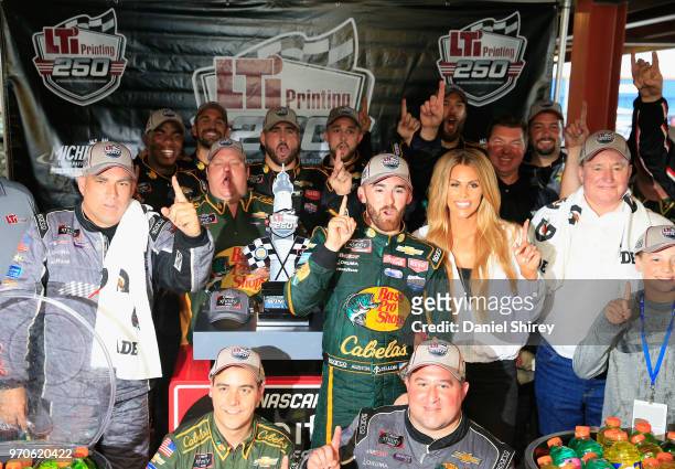 Austin Dillon, driver of the Bass Pro Shops/Cabela's Chevrolet, celebrates with the trophy after winning the NASCAR Xfinity Series LTi Printing 250...