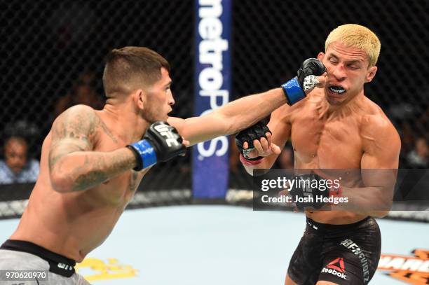 Sergio Pettis punches Joseph Benavidez in their flyweight fight during the UFC 225 event at the United Center on June 9, 2018 in Chicago, Illinois.