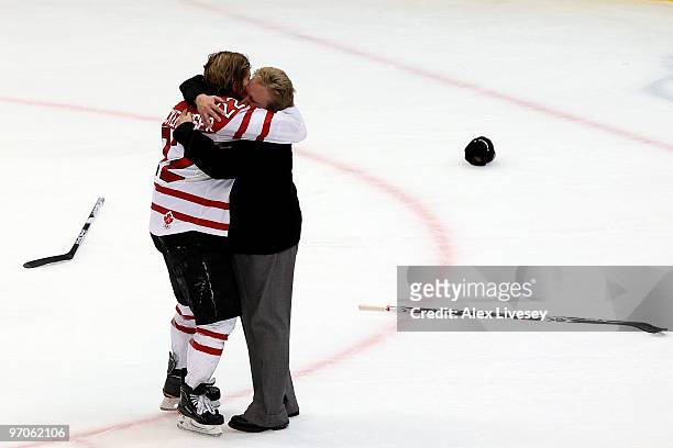 Hayley Wickenheiser of Canada is hugged by Melody Davidson the Canada head coach following their their team's 2-0 victory during the ice hockey...