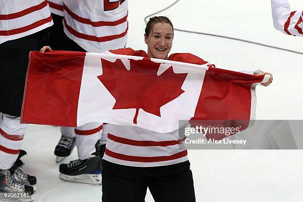 Colleen Sostorics of Canada celebrates following her team's 2-0 victory during the ice hockey women's gold medal game between Canada and USA on day...