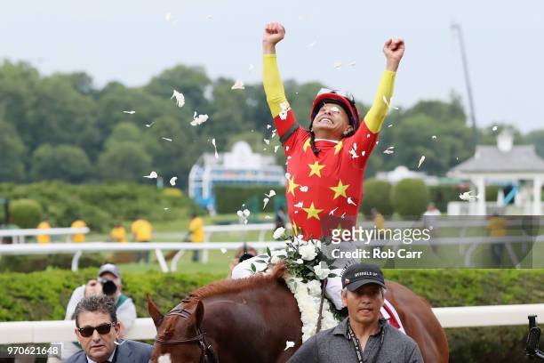 Jockey Mike Smith celebrates atop of Justify the 150th running of the Belmont Stakes at Belmont Park on June 9, 2018 in Elmont, New York. Justify...