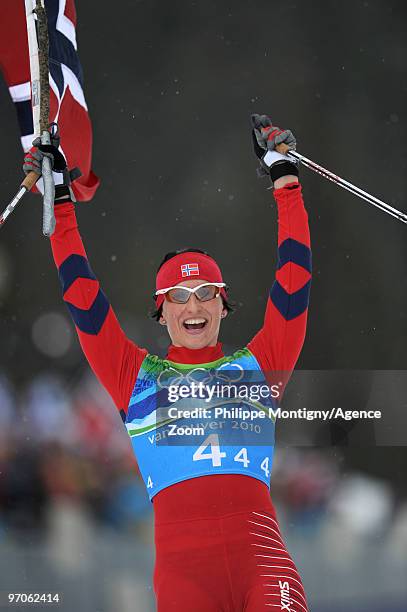 Marit Bjoergen takes the Gold Medal for Team Norway during the WomenÕs Cross Country Skiing 4x5km Relay on Day 14 of the 2010 Vancouver Winter...