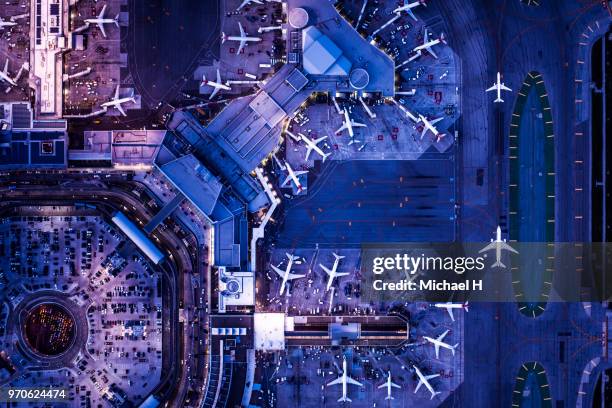 twilight airport helicopter shot.a moving aircraft. - airport traffic stockfoto's en -beelden