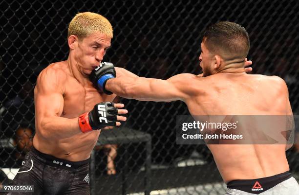 Sergio Pettis punches Joseph Benavidez in their flyweight fight during the UFC 225 event at the United Center on June 9, 2018 in Chicago, Illinois.