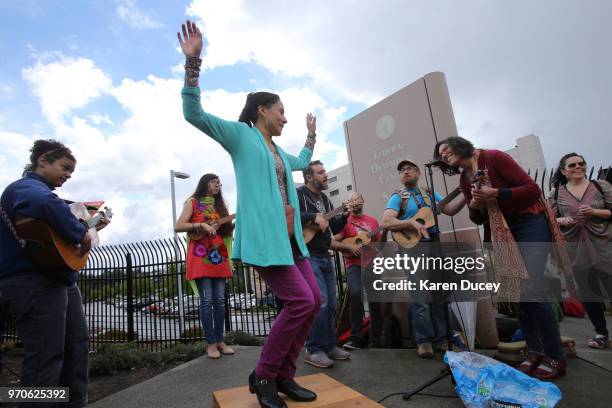 The Seattle Fandango Project perform during a protest outside a Federal Detention Center holding migrant women on June 9, 2018 in SeaTac, Washington....
