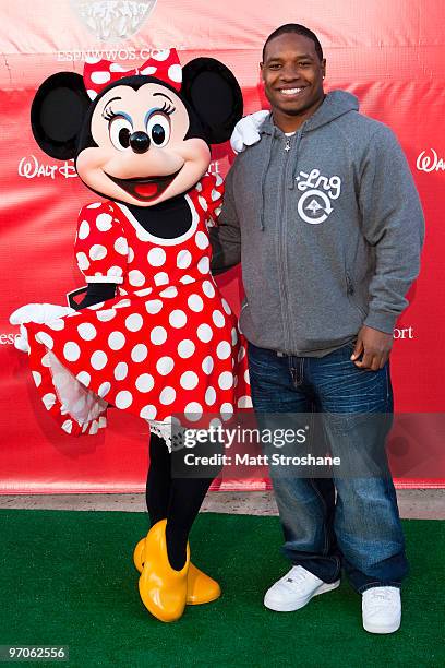 Maurice Jones-Drew, running back for the Jacksonville Jaguars, walks the red carpet with Minnie Mouse at the official relaunch of the ESPN Wide World...