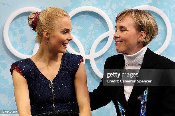 Kiira Korpi of Finland sits in the kiss and cry area with coach Susanna Haarala in the Ladies Free Skating on day 14 of the 2010 Vancouver Winter...