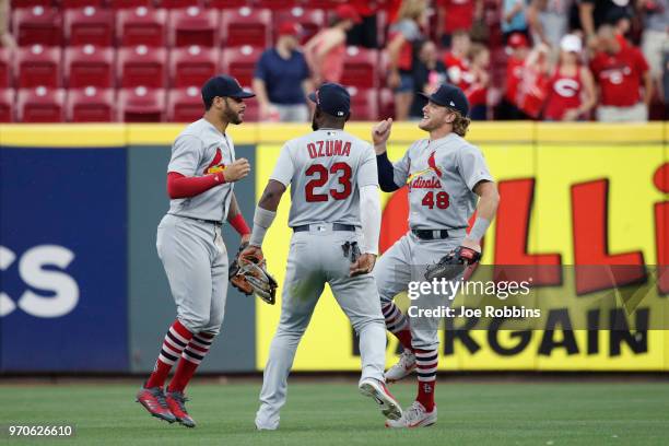 Tommy Pham, Marcell Ozuna and Harrison Bader of the St. Louis Cardinals celebrate after the game against the Cincinnati Reds at Great American Ball...