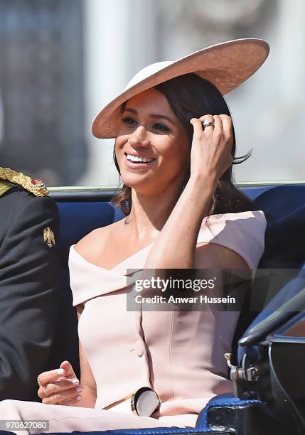 Meghan, Duchess of Sussex travel sin an open carriage to the Trooping the Colour ceremony on June 09, 2018 in London, England.