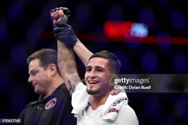 Sergio Pettis celebrates after beating Joseph Benavidez by split decision in their flyweight bout during the UFC 225: Whittaker v Romero 2 event at...