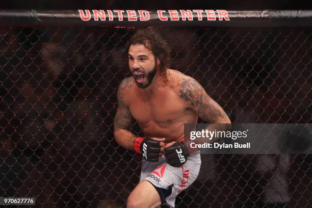 Clay Guida enters the octagon before his lightweight bout against Charles Oliveira of Brazil during the UFC 225: Whittaker v Romero 2 event at the...