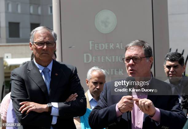 Congressman Denny Heck speaks at a press conference outside a Federal Detention Center holding migrant women as Washington state Governor Jay Inslee...