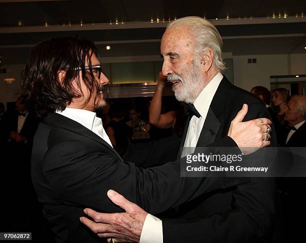 Actors Johnny Depp and Sir Christopher Lee greet each other at the Royal World Premiere of 'Alice In Wonderland' at Odeon Leicester Square on...