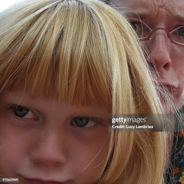 angry looks of child and woman - lucy lambriex stock-fotos und bilder