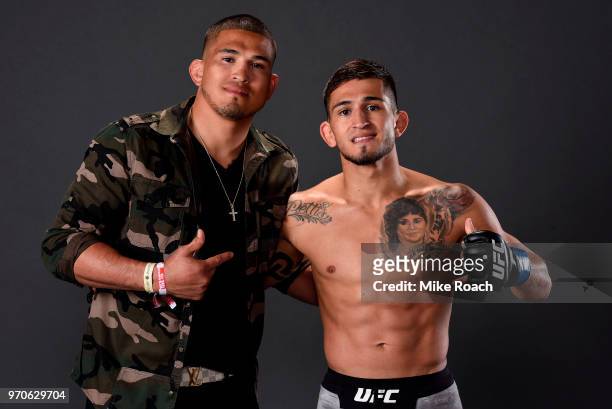 Sergio Pettis poses with his borther Anthony Pettis for a post fight portrait backstage during the UFC 225 event at the United Center on June 9, 2018...