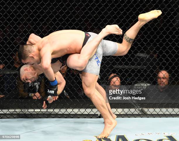 Ricardo Lamas takes down Mirsad Bektic of Bosnia in their featherweight fight during the UFC 225 event at the United Center on June 9, 2018 in...