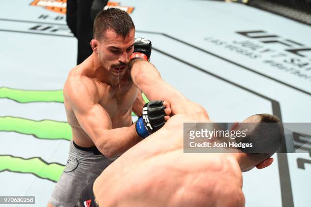 Ricardo Lamas punches Mirsad Bektic of Bosnia in their featherweight fight during the UFC 225 event at the United Center on June 9, 2018 in Chicago,...