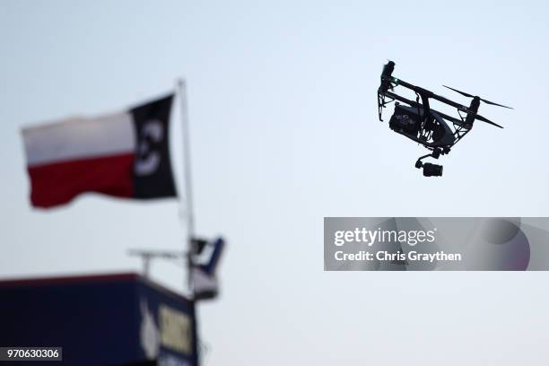 Technology Inspire 2 Drone delivers the green flag to the starter's stand prior to the Verizon IndyCar Series DXC Technology 600 at Texas Motor...