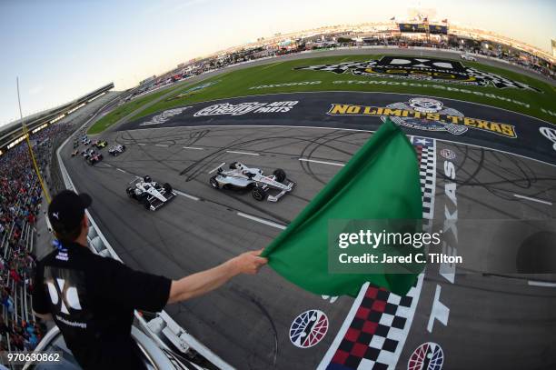 Josef Newgarden, driver of the Verizon Team Penske Chevrolet, leads Simon Pagenaud, driver of the DXC Technology Team Penske Chevrolet, at the start...