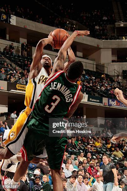 Ford of the Indiana Pacers shoots over Brandon Jennings of the Milwaukee Bucks at Conseco Fieldhouse on February 25, 2010 in Indianapolis, Indiana....