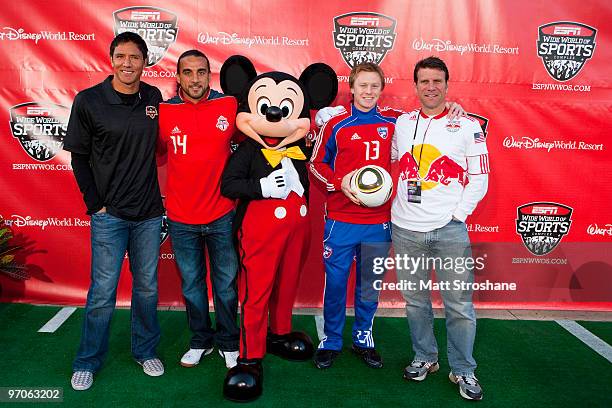 Soccer players Brian Ching , of the Houston Dynamo, Dwayne DeRosario, of the Toronto FC, Mickey Mouse, Dax McCarty, of FC Dallas, and Jeff Agoos, of...