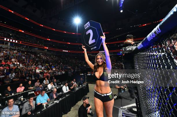 Octagon Girl Arianny Celeste signals the start of round two between Claudia Gadelha of Brazil and Carla Esparza during the UFC 225 event at the...