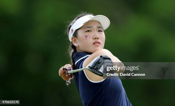 Lucy Li of the United States team plays her tee shot on the 11th hole in her match with Sophia Schubertagainst Paula Grant and Shannon McWilliam of...
