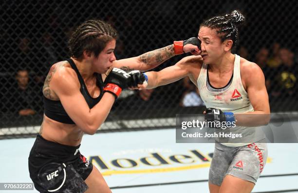 Claudia Gadelha of Brazil punches Carla Esparza in their women's strawweight fight during the UFC 225 event at the United Center on June 9, 2018 in...