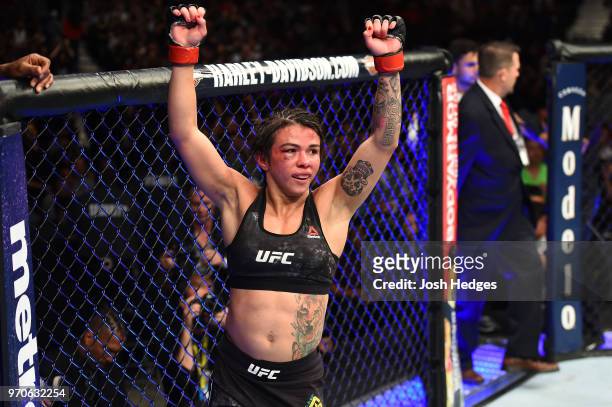 Claudia Gadelha of Brazil reacts after finishing three rounds against Carla Esparza in their women's strawweight fight during the UFC 225 event at...