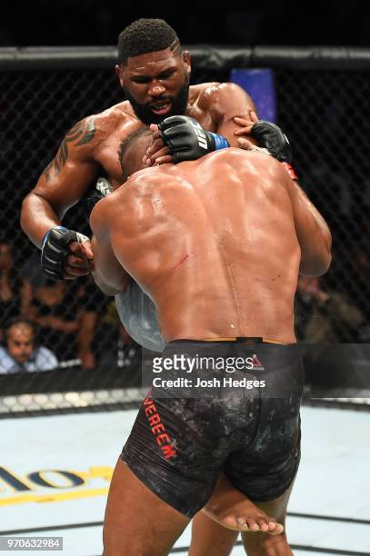 Curtis Blaydes knees the body of Alistair Overeem in their heavyweight fight during the UFC 225 event at the United Center on June 9, 2018 in...
