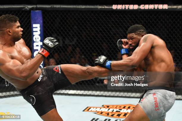 Alistair Overeem kicks the body of Curtis Blaydes in their heavyweight fight during the UFC 225 event at the United Center on June 9, 2018 in...