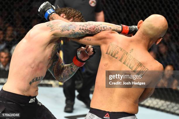 Punk punches Mike Jackson in their welterweight fight during the UFC 225 event at the United Center on June 9, 2018 in Chicago, Illinois.