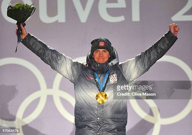 Bill Demong of the United States celebrates receiving the gold medal during the medal ceremony for the men's individual large hill 10 km Nordic...