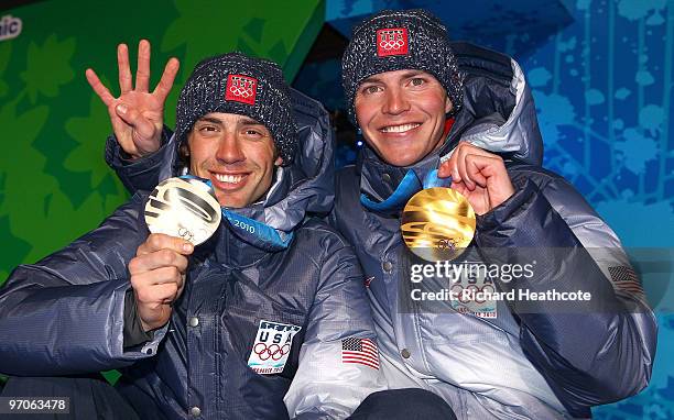 Johnny Spillane of the United States receives the silver medal and Bill Demong of the United States receives the gold medal during the medal ceremony...