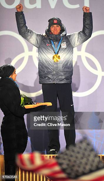 Bill Demong of the United States receives the gold medal during the medal ceremony for the men's individual large hill 10 km Nordic combined held at...