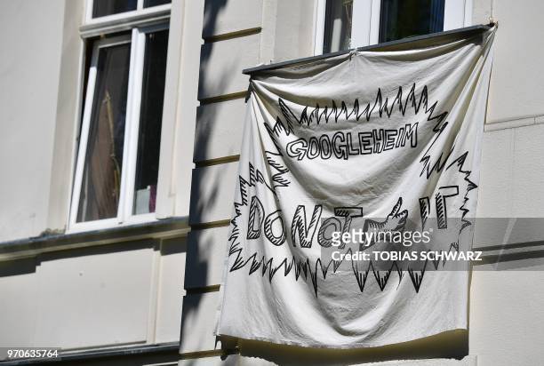 Banner is pictured at an appartement house in Berlin's Kreuzberg district on May 22, 2018. - Global cities from Seoul to Tel Aviv have welcomed...