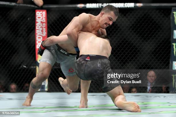 Mirsad Bektic of Bosnia attempts to take down Ricardo Lamas in the second round in their featherweight bout during the UFC 225: Whittaker v Romero 2...