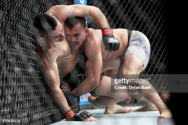 Mirsad Bektic of Bosnia takes down Ricardo Lamas in the second round in their featherweight bout during the UFC 225: Whittaker v Romero 2 event at...