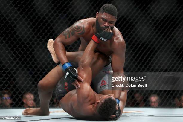 Curtis Blaydes attempts to pin Alistair Overeem of England in the second round in their heavyweight bout during the UFC 225: Whittaker v Romero 2...