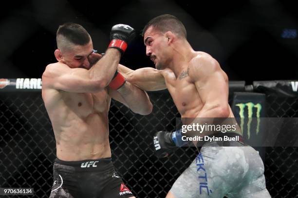 Mirsad Bektic of Bosnia punches Ricardo Lamas in the second round in their featherweight bout during the UFC 225: Whittaker v Romero 2 event at the...