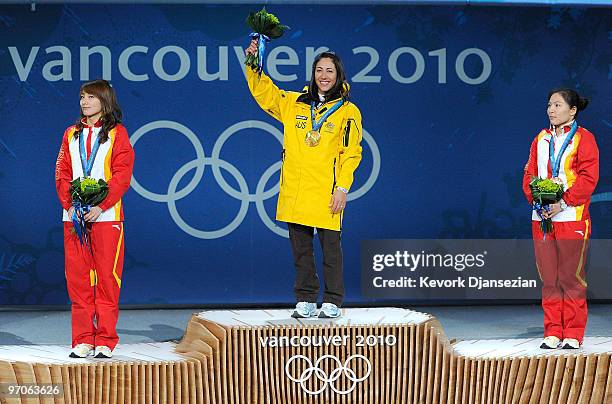 Li Nina of China receives the silver medal, Lydia Lassila of Australia receives the gold medal and Guo Xinxin of China receives the bronze medal...